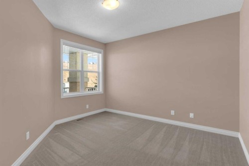 106-1000 Glenhaven Way, Cochrane, AB - Indoor Photo Showing Other Room