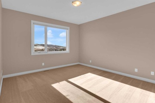 106-1000 Glenhaven Way, Cochrane, AB - Indoor Photo Showing Other Room