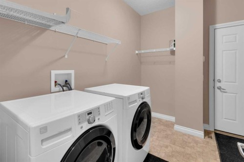 106-1000 Glenhaven Way, Cochrane, AB - Indoor Photo Showing Laundry Room