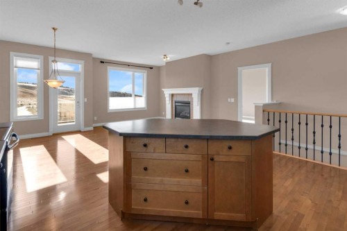 106-1000 Glenhaven Way, Cochrane, AB - Indoor With Fireplace