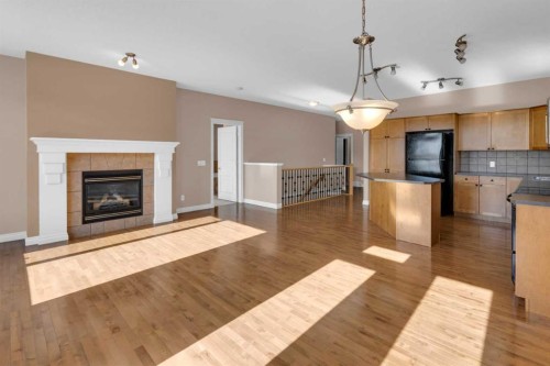 106-1000 Glenhaven Way, Cochrane, AB - Indoor With Fireplace