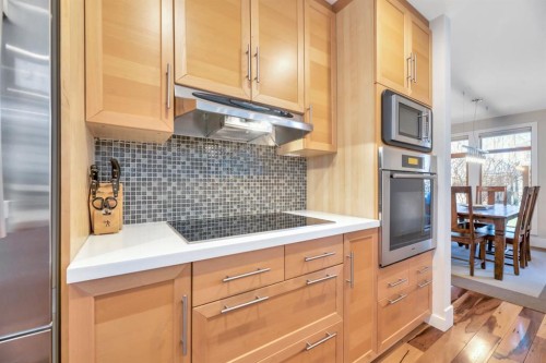 31 Ranch Road, Okotoks, AB - Indoor Photo Showing Kitchen With Upgraded Kitchen