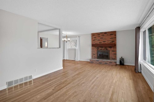 14543 Parkside Drive Se, Calgary, AB - Indoor Photo Showing Living Room With Fireplace