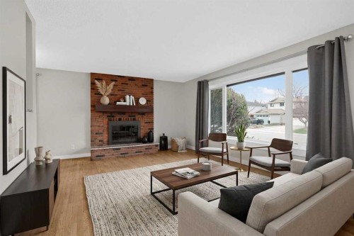 14543 Parkside Drive Se, Calgary, AB - Indoor Photo Showing Living Room With Fireplace