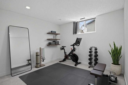 14543 Parkside Drive Se, Calgary, AB - Indoor Photo Showing Gym Room