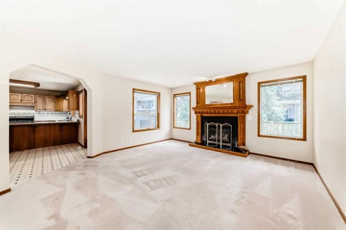 164 Cove Road, Chestermere, AB - Indoor Photo Showing Living Room With Fireplace