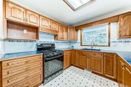 164 Cove Road, Chestermere, AB - Indoor Photo Showing Kitchen With Double Sink