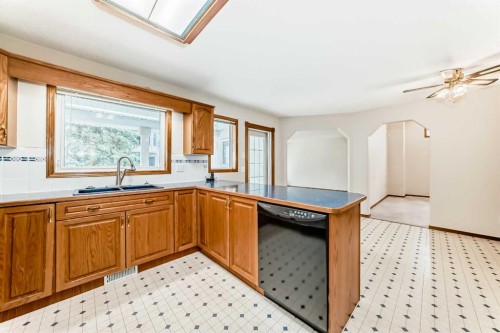 164 Cove Road, Chestermere, AB - Indoor Photo Showing Kitchen With Double Sink