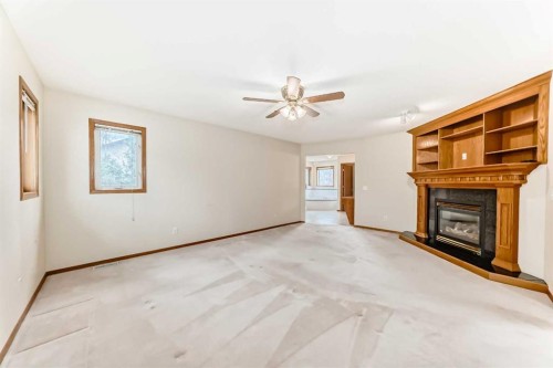 164 Cove Road, Chestermere, AB - Indoor With Fireplace