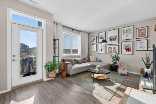 203-445 Redstone Ne, Calgary, AB - Indoor Photo Showing Living Room