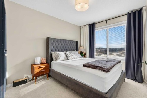203-445 Redstone Ne, Calgary, AB - Indoor Photo Showing Bedroom