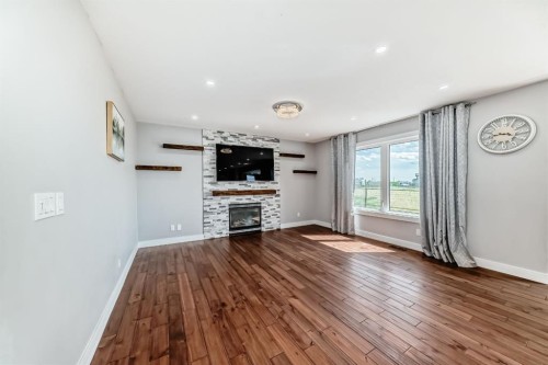 240076 Paradise Meadow Drive, Chestermere, AB - Indoor Photo Showing Living Room With Fireplace