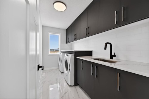 709 Dawson Common, Chestermere, AB - Indoor Photo Showing Laundry Room