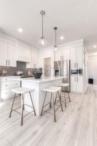 34 Bridgeport Circle, Chestermere, AB - Indoor Photo Showing Kitchen With Stainless Steel Kitchen With Upgraded Kitchen