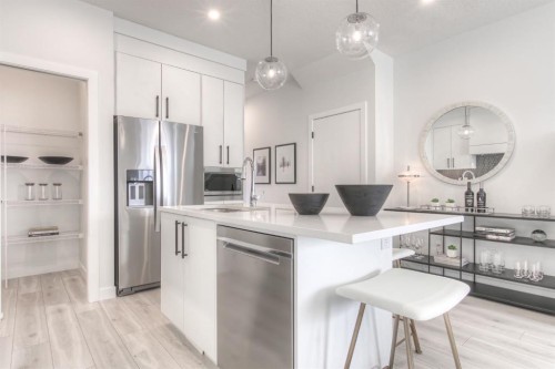 34 Bridgeport Circle, Chestermere, AB - Indoor Photo Showing Kitchen With Stainless Steel Kitchen With Upgraded Kitchen