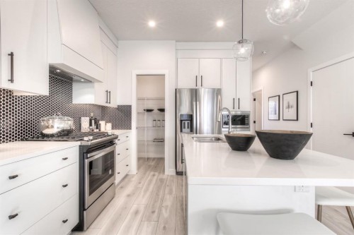 34 Bridgeport Circle, Chestermere, AB - Indoor Photo Showing Kitchen With Stainless Steel Kitchen With Upgraded Kitchen