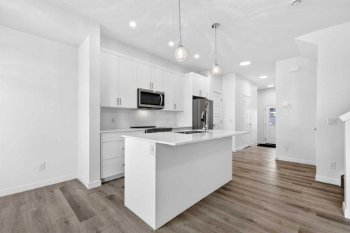50 Creekside Way Sw, Calgary, AB - Indoor Photo Showing Kitchen With Upgraded Kitchen