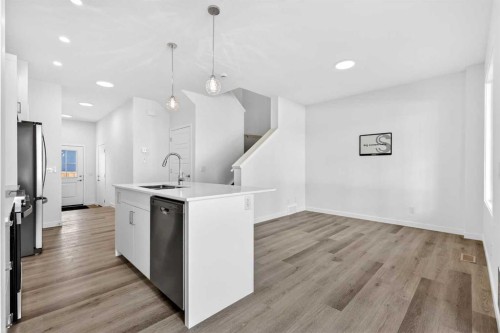 50 Creekside Way Sw, Calgary, AB - Indoor Photo Showing Kitchen With Upgraded Kitchen