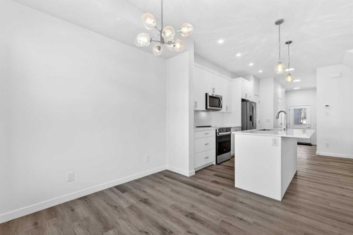 50 Creekside Way Sw, Calgary, AB - Indoor Photo Showing Kitchen With Upgraded Kitchen