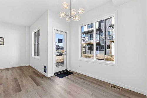 50 Creekside Way Sw, Calgary, AB - Indoor Photo Showing Other Room
