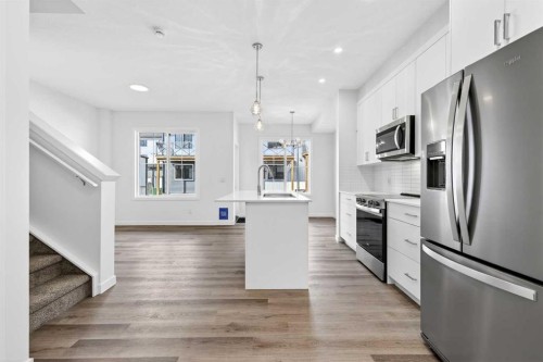 50 Creekside Way Sw, Calgary, AB - Indoor Photo Showing Kitchen With Stainless Steel Kitchen With Upgraded Kitchen