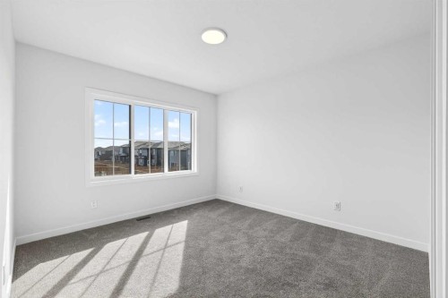 50 Creekside Way Sw, Calgary, AB - Indoor Photo Showing Other Room