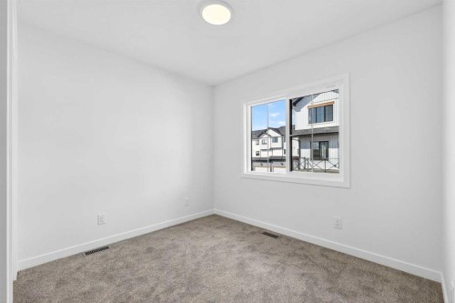 50 Creekside Way Sw, Calgary, AB - Indoor Photo Showing Other Room