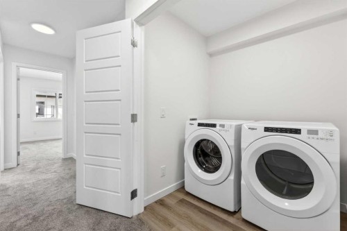 50 Creekside Way Sw, Calgary, AB - Indoor Photo Showing Laundry Room