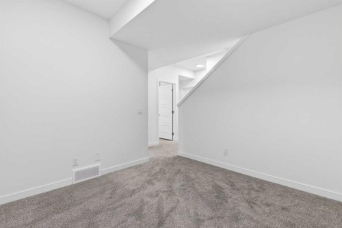50 Creekside Way Sw, Calgary, AB - Indoor Photo Showing Other Room