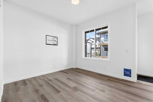 50 Creekside Way Sw, Calgary, AB - Indoor Photo Showing Other Room