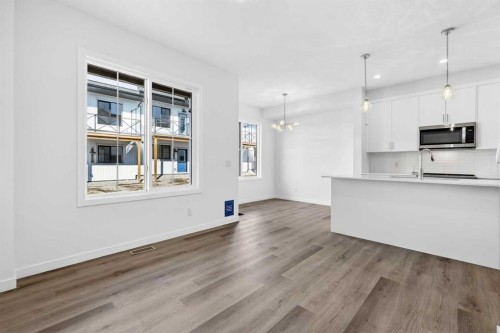 50 Creekside Way Sw, Calgary, AB - Indoor Photo Showing Kitchen With Upgraded Kitchen