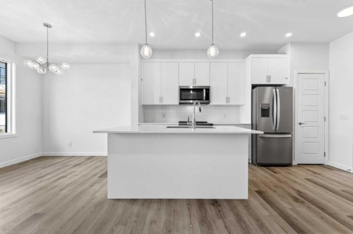50 Creekside Way Sw, Calgary, AB - Indoor Photo Showing Kitchen With Stainless Steel Kitchen With Upgraded Kitchen