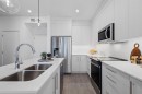 3314-6 Merganser Drive West, Chestermere, AB  - Indoor Photo Showing Kitchen With Double Sink With Upgraded Kitchen 