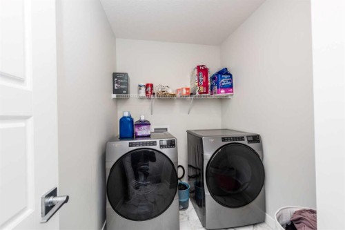 137 Edith Villas Nw, Calgary, AB - Indoor Photo Showing Laundry Room