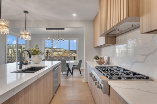 28 Spring Creek Point Sw, Calgary, AB - Indoor Photo Showing Kitchen With Double Sink With Upgraded Kitchen