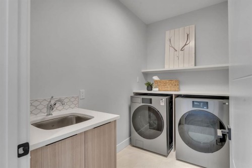28 Spring Creek Point Sw, Calgary, AB - Indoor Photo Showing Laundry Room
