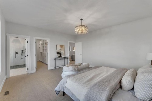 28 Spring Creek Point Sw, Calgary, AB - Indoor Photo Showing Bedroom