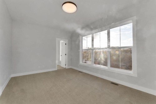 28 Spring Creek Point Sw, Calgary, AB - Indoor Photo Showing Other Room