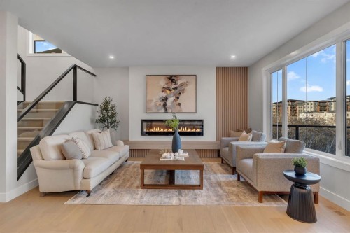 28 Spring Creek Point Sw, Calgary, AB - Indoor Photo Showing Living Room With Fireplace