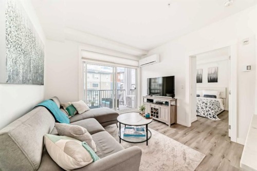 311-40 Walgrove Walk Se, Calgary, AB - Indoor Photo Showing Living Room