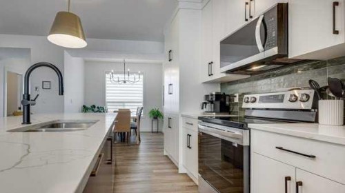 B-10 Evergreen Way, Red Deer, AB - Indoor Photo Showing Kitchen With Double Sink