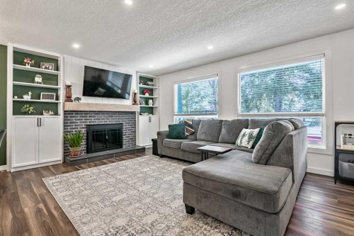 11835 Elbow Drive Sw, Calgary, AB - Indoor Photo Showing Living Room With Fireplace