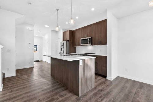 54 Creekside Way Sw, Calgary, AB - Indoor Photo Showing Kitchen With Upgraded Kitchen