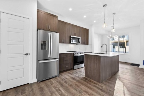 54 Creekside Way Sw, Calgary, AB - Indoor Photo Showing Kitchen With Stainless Steel Kitchen With Upgraded Kitchen