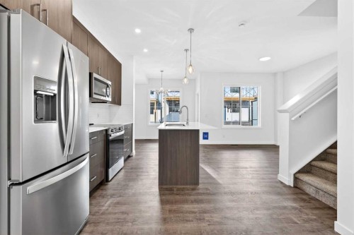 54 Creekside Way Sw, Calgary, AB - Indoor Photo Showing Kitchen With Stainless Steel Kitchen With Upgraded Kitchen