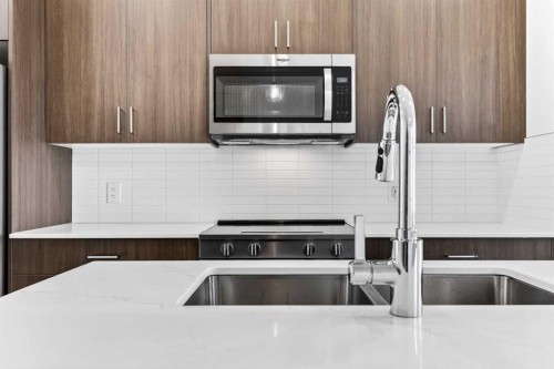 54 Creekside Way Sw, Calgary, AB - Indoor Photo Showing Kitchen With Double Sink