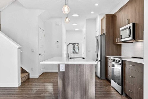 54 Creekside Way Sw, Calgary, AB - Indoor Photo Showing Kitchen With Stainless Steel Kitchen With Upgraded Kitchen