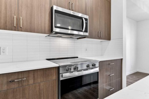 54 Creekside Way Sw, Calgary, AB - Indoor Photo Showing Kitchen With Upgraded Kitchen