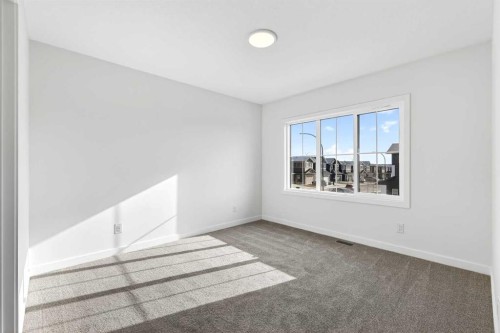 54 Creekside Way Sw, Calgary, AB - Indoor Photo Showing Other Room