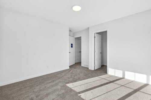 54 Creekside Way Sw, Calgary, AB - Indoor Photo Showing Other Room